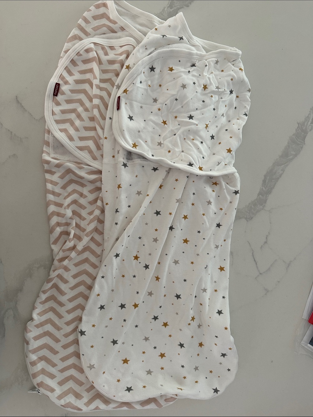 Two Momcozy Baby Swaddle Sleep Sacks